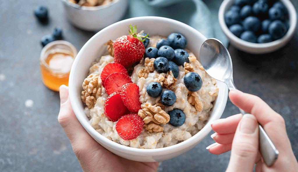 bowl of oatmeal with berries and nuts